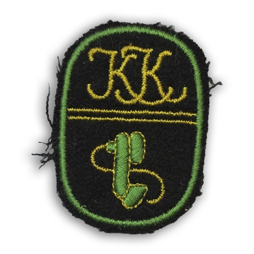 Lottamerkit kuvailtuna:: Viestilotan merkki, jossa on vihreä kenttäpuhelimen kuulotorvi mustalla pohjalla